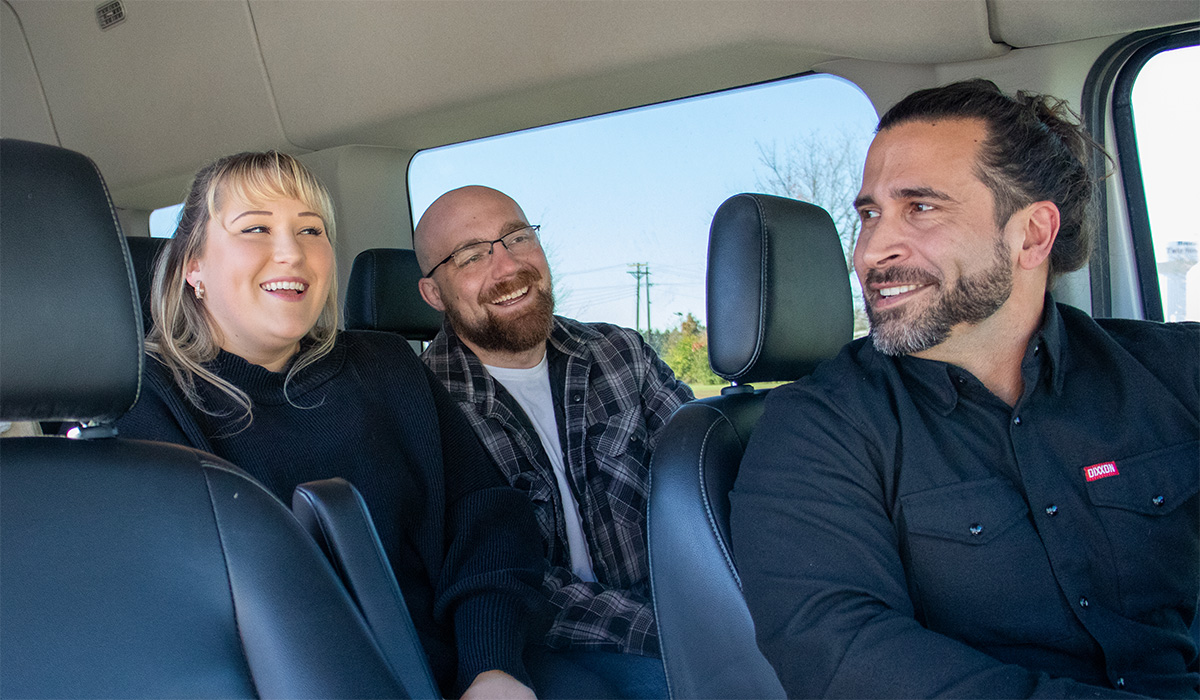 Tour guests inside 10 passenger Ford Transit van