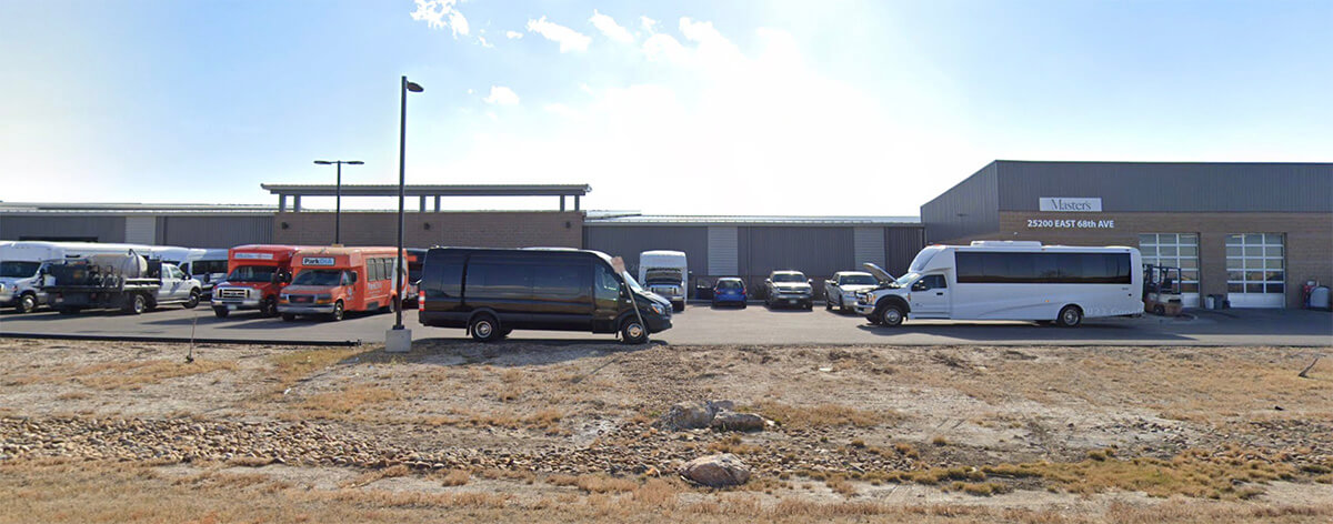 Exterior view of Master's Transportation's Denver bus dealership.